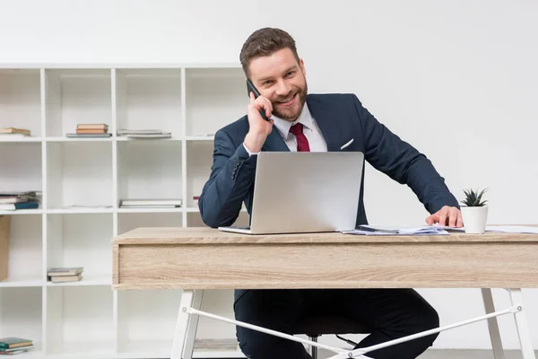 Confident businessman talking on phone — Stock Photo