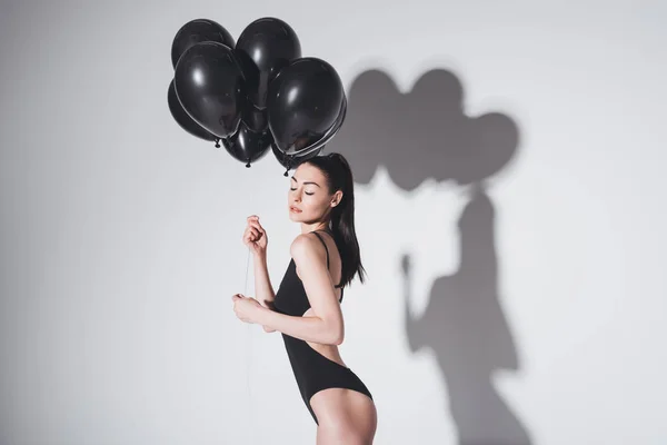 Beautiful woman with balloons — Stock Photo
