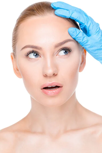 Cosmetologist examining face of patient — Stock Photo, Image