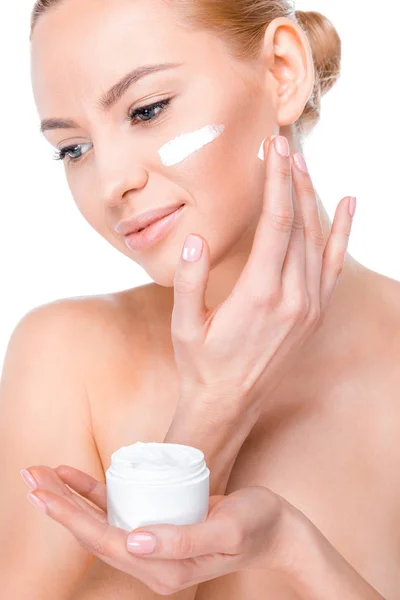 Woman applying cream — Stock Photo, Image