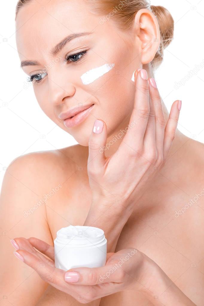 woman applying cream