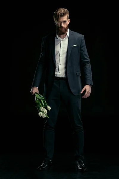 Homem elegante com tulipas — Fotografia de Stock