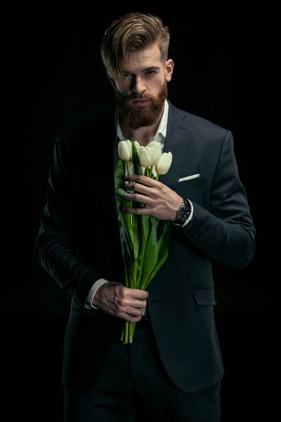 Homem elegante com tulipas — Fotografia de Stock