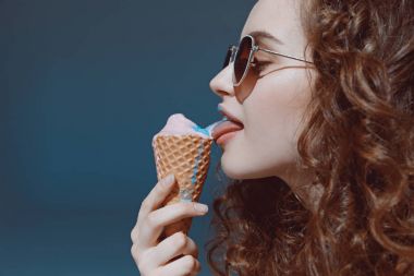 girl in sunglasses eating ice cream clipart