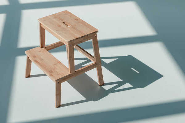 wooden flower stand at empty room