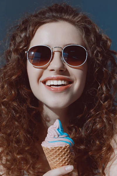 Girl in sunglasses eating ice cream — Stock Photo, Image