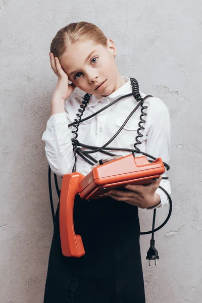 Tired child with telephone — Stock Photo, Image