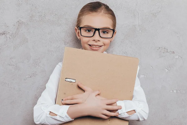 Child with folder in hands — Stock Photo, Image