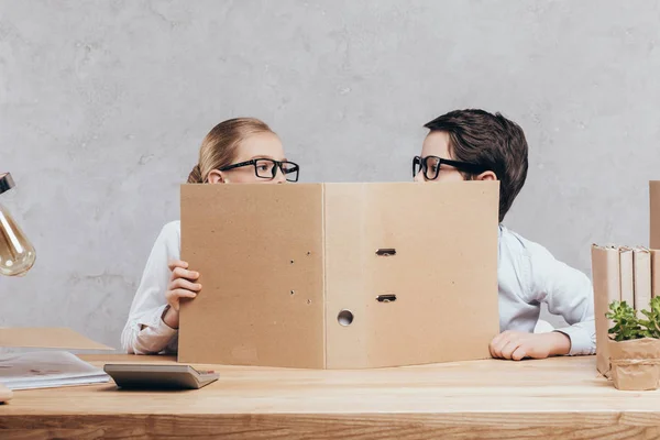 Children with folder at workplace — Stock Photo, Image