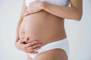 pregnant woman touching belly clipart