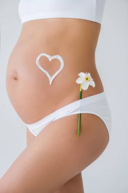 pregnant belly with flower and heart clipart