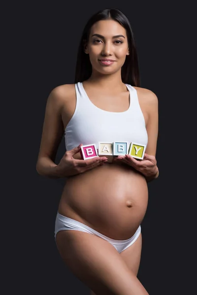 아기 단어로 임신한 여자 — 스톡 사진