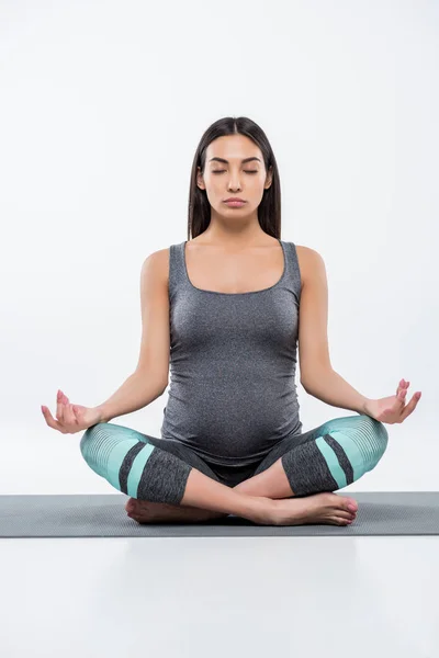 Pregnant woman in lotus pose — Stock Photo, Image