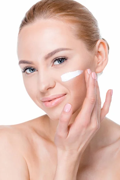 Woman applying cream — Stock Photo