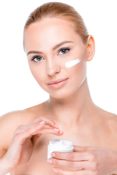 Woman applying cream — Stock Photo