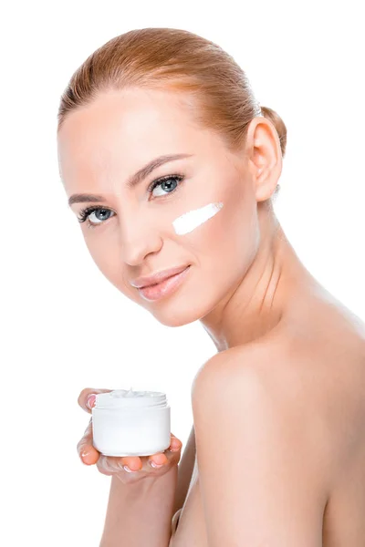 Woman showing face cream — Stock Photo