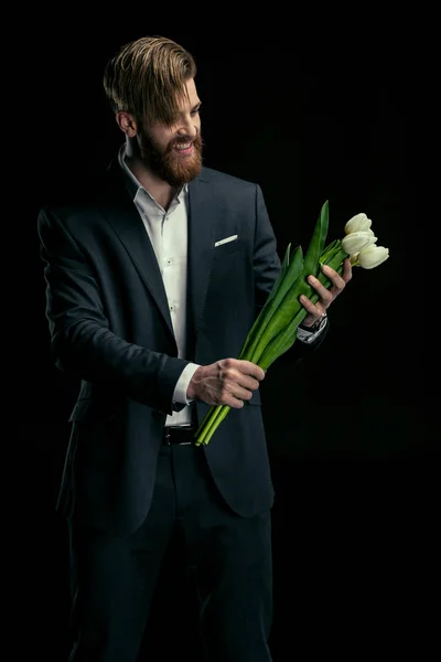 Homem elegante com tulipas — Fotografia de Stock
