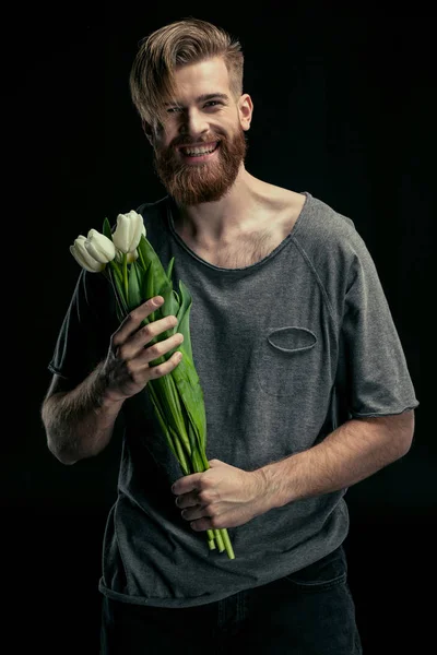 Stylish man with tulips — Stock Photo