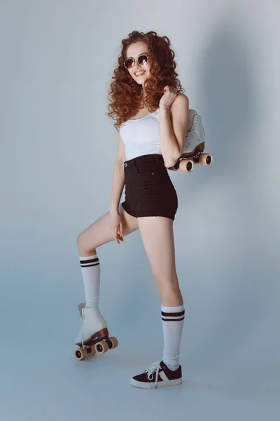 Hipster girl with roller skates — Stock Photo