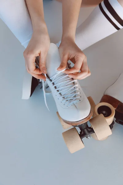 Hipster girl with roller skates — Stock Photo