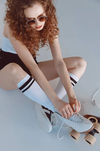 Hipster girl with roller skates — Stock Photo