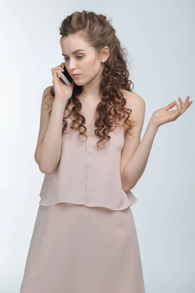 Woman talking on smartphone — Stock Photo