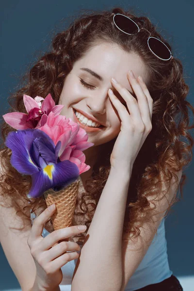 Young woman with flowers — Stock Photo