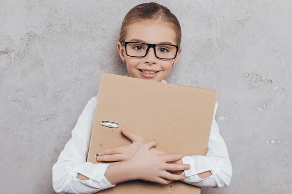 Child with folder in hands — Stock Photo