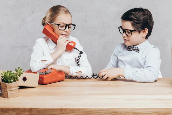 Little girl talking on telephone — Stock Photo