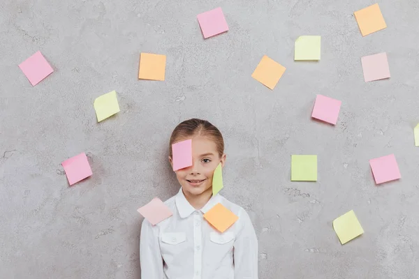 Child with stickers on face — Stock Photo