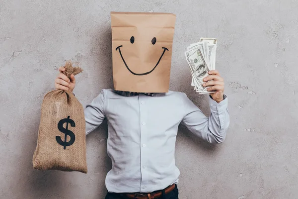 Child with cash and money bag — Stock Photo