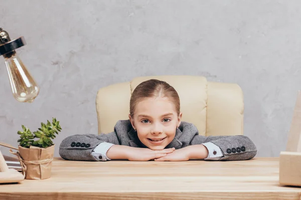 Smiling child at workplace — Stock Photo