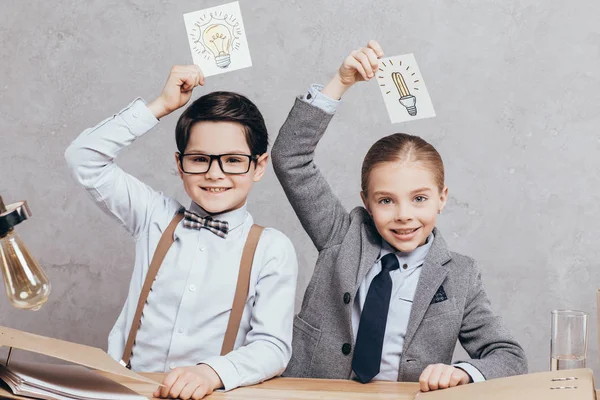 Kids holding cards with ides sign — Stock Photo