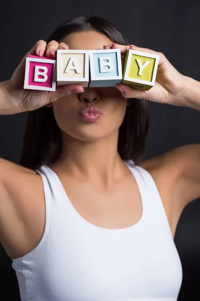 Donna con parola bambino — Foto stock