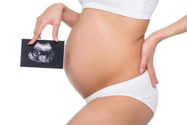 Pregnant woman with ultrasound scan — Stock Photo