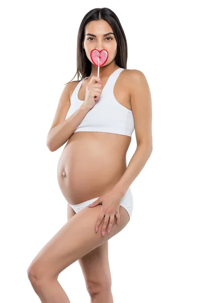 Mujer embarazada con piruleta - foto de stock