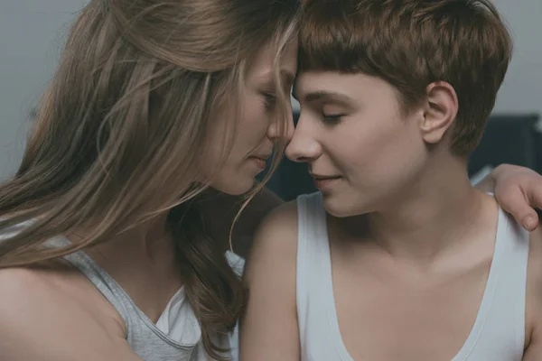 Close-up hot of young cuddling lesbian couple — Stock Photo