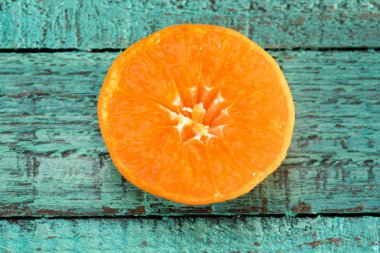 Orange slice on table clipart