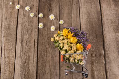 Flowers in shopping trolley clipart