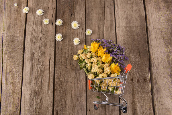 Flowers in shopping trolley