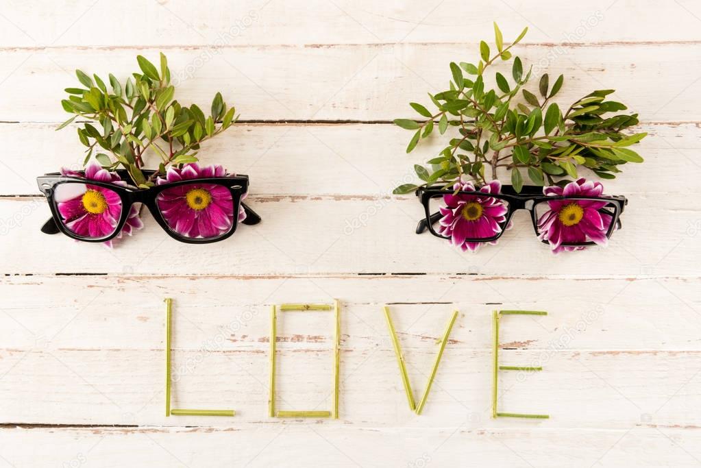 Eyeglasses and pink flowers