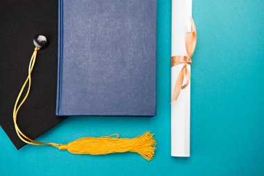 book, graduation cap and diploma clipart