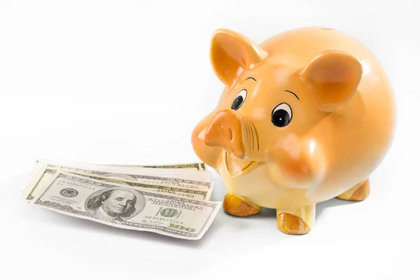 Piggy bank and dollar banknotes — Stock Photo, Image