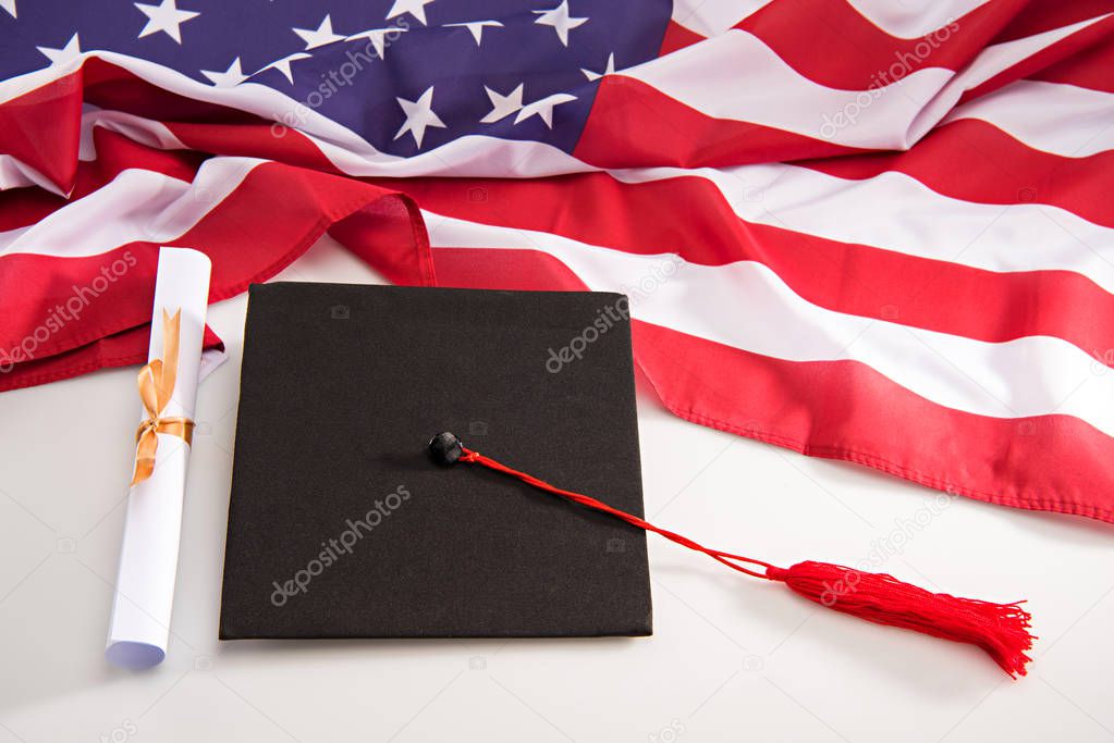 Graduation mortarboard and diploma 