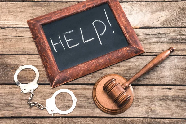 Handcuff, judge hammer and chalkboard — Stock Photo, Image