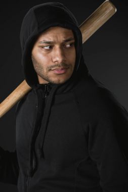 african american robber with baseball bat
