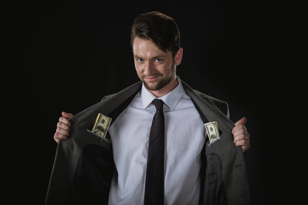 Бизнесмен с долларовыми банкнотами
