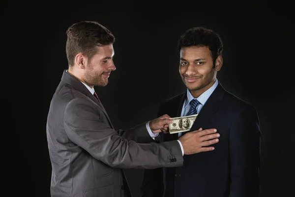 Businessman bribing partner — Stock Photo, Image