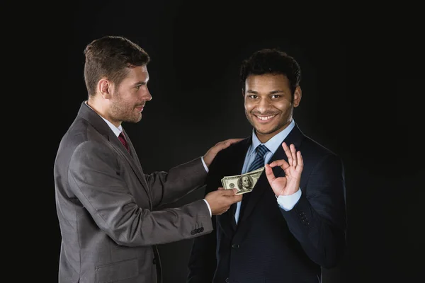 Businessman bribing partner — Free Stock Photo