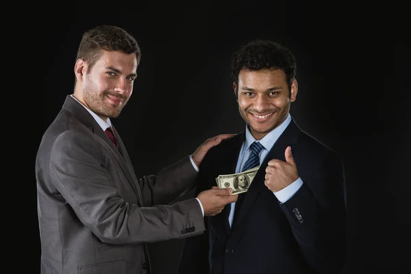 Businessman bribing partner — Stock Photo, Image